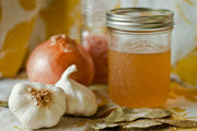 Picture of garlic, onions and a jar 